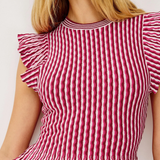 Red and white striped top with ruffled sleeves on a plain background