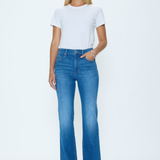 Woman wearing a white t-shirt and blue jeans on a white background