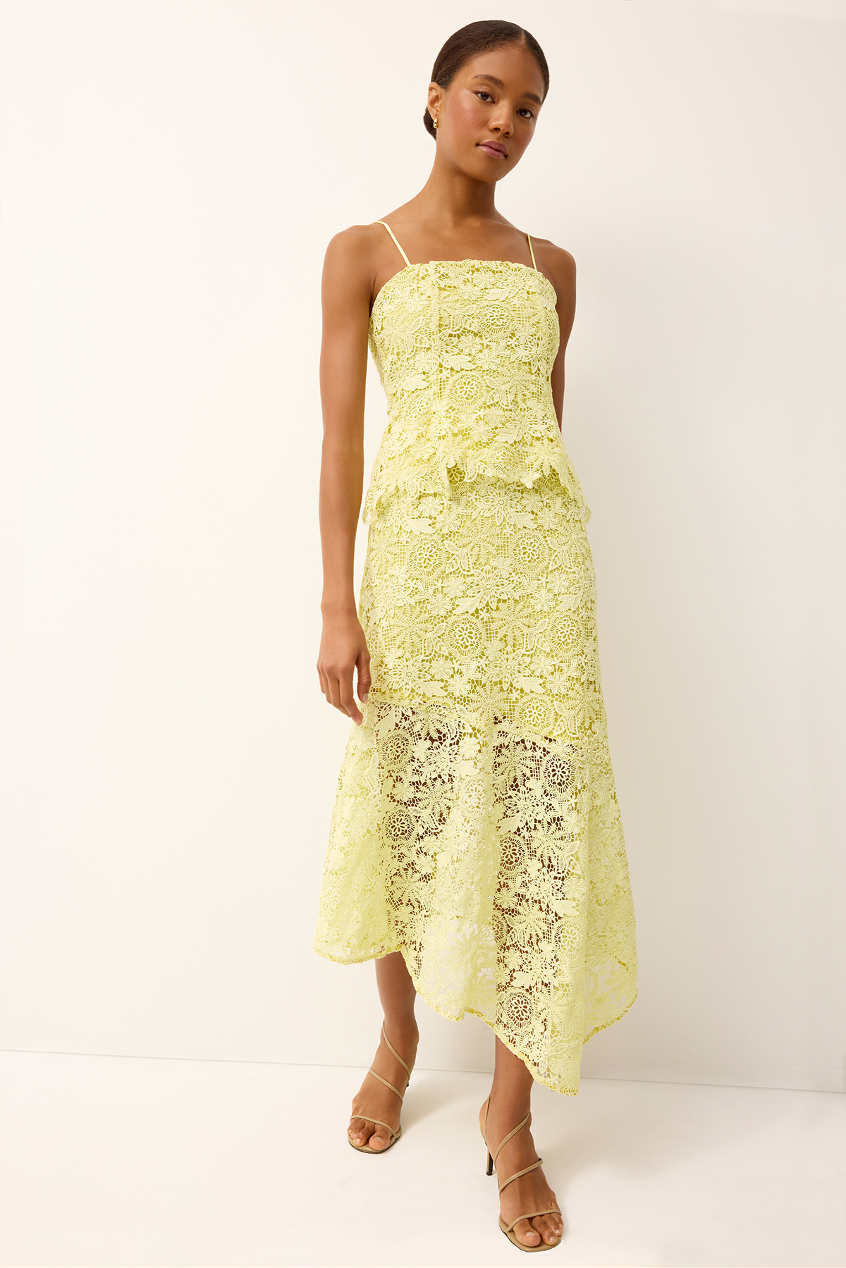woman in yellow lace set on white background 