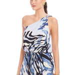 Woman wearing a one-shoulder dress with a blue and white pattern on a white background