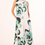 woman in floral printed dress on white background 