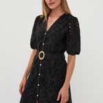 woman in black mini dress on white background 