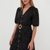 woman in black mini dress on white background 