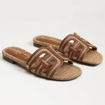 Pair of brown sandals with woven design on a white background