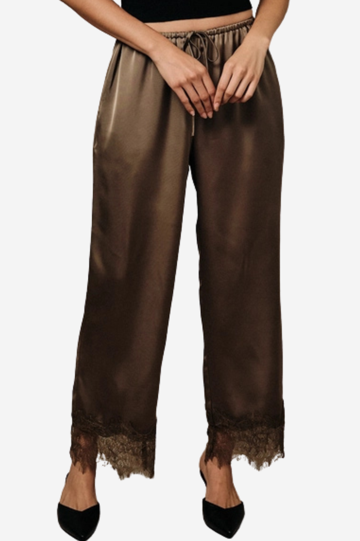 A person wearing wide-leg brown satin pants with a lace hem, paired with black pointed shoes against a plain light gray background.