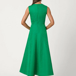 Green dress worn by a model on a white background