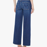 Person wearing blue jeans on a white background