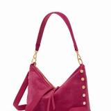Pink handbag with gold accents on a white background