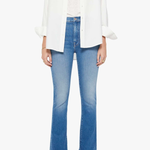 woman in white button down and blue denim on white background 
