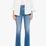 woman in white button down and blue denim on white background 
