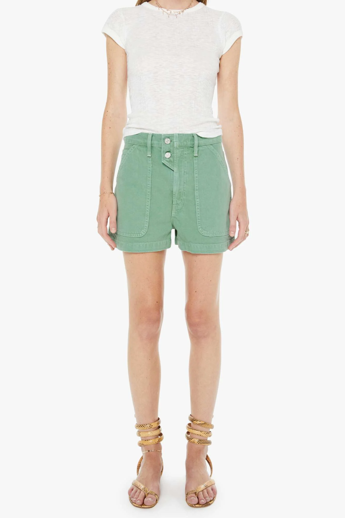 Person wearing a white t-shirt and green shorts on a white background