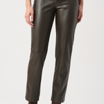 Person wearing dark brown leather pants on a white background