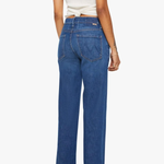 Person wearing blue jeans and a white top on a white background