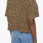 Model wearing a brown striped short-sleeve boxy ringer T-shirt with contrast trim and blue denim.