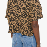 Model wearing a brown striped short-sleeve boxy ringer T-shirt with contrast trim and blue denim.