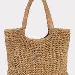 Beige woven handbag on a light beige background