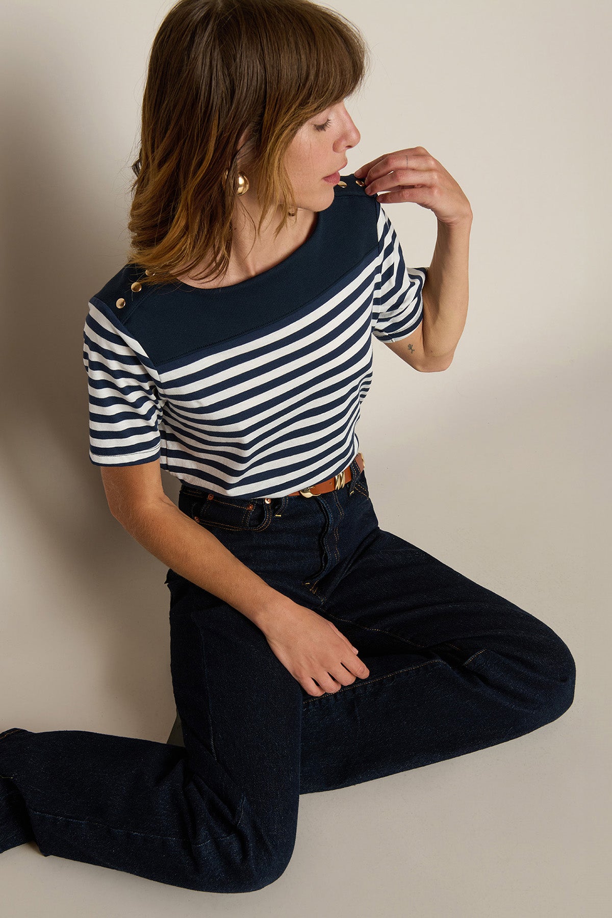 Striped short-sleeve tee with a relaxed fit, styled with denim