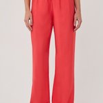 Person wearing bright red pants on a white background