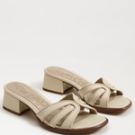Beige sandals with a block heel on a white background