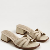 Beige sandals with a block heel on a white background