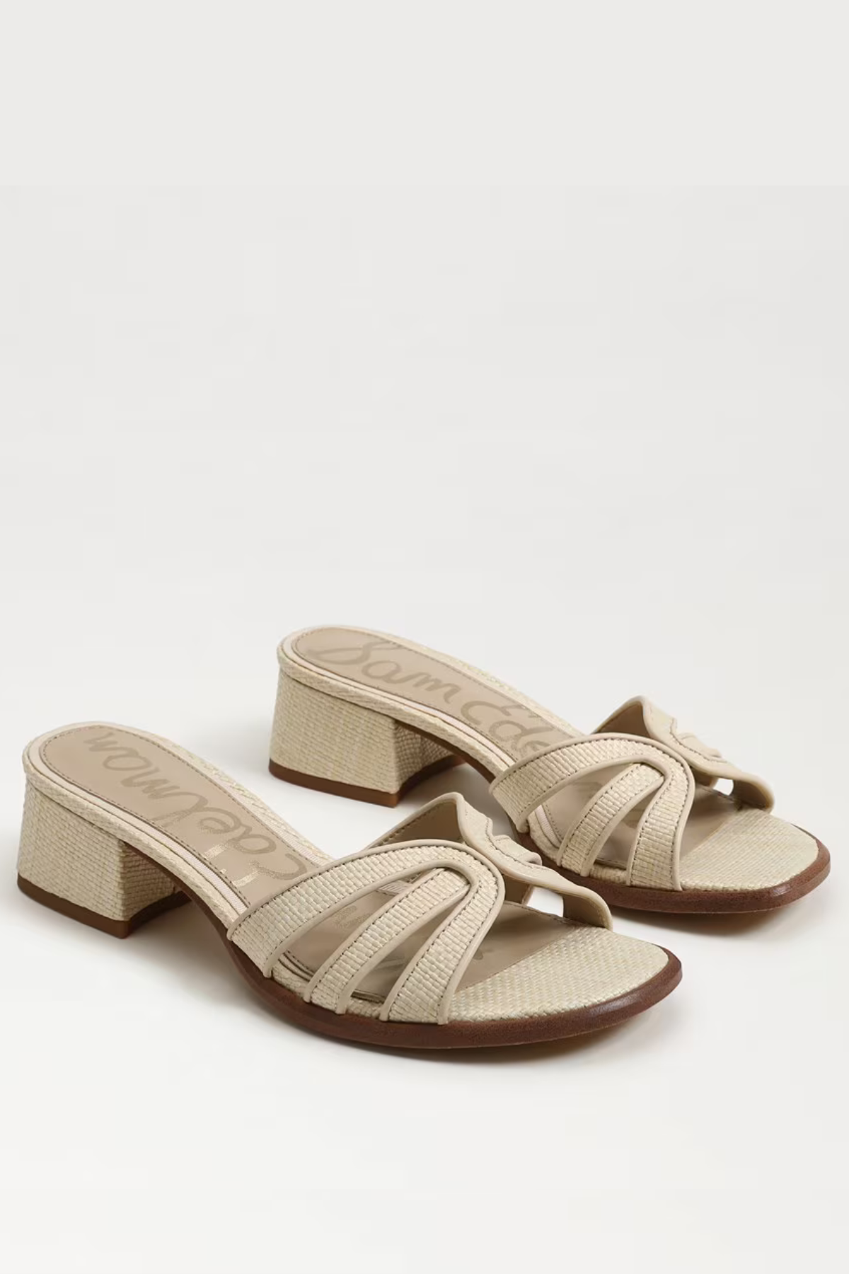 Beige sandals with a block heel on a white background