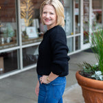 Minimal knit sweater with rolled edge detailing