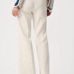 Model wearing white high-rise stretch denim wide-leg jeans with a full-length silhouette.