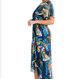 Model wearing a blue printed short-sleeve midi dress featuring a flattering waist and flowing skirt.