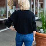 Minimal knit sweater with rolled edge detailing