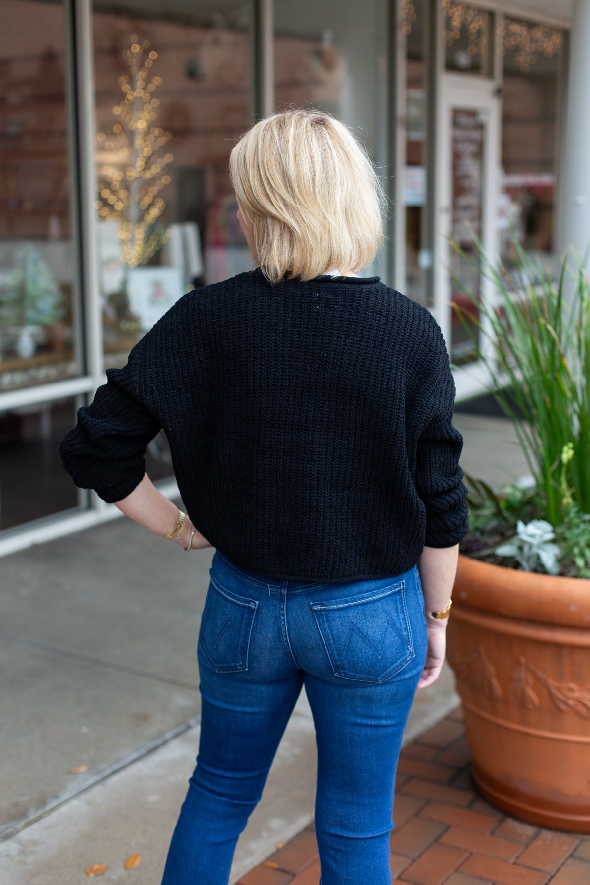 Minimal knit sweater with rolled edge detailing