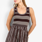 Model wearing a sleeveless fitted tank top with a classic neckline and streamlined silhouette.