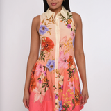 Woman wearing a floral dress with a white background