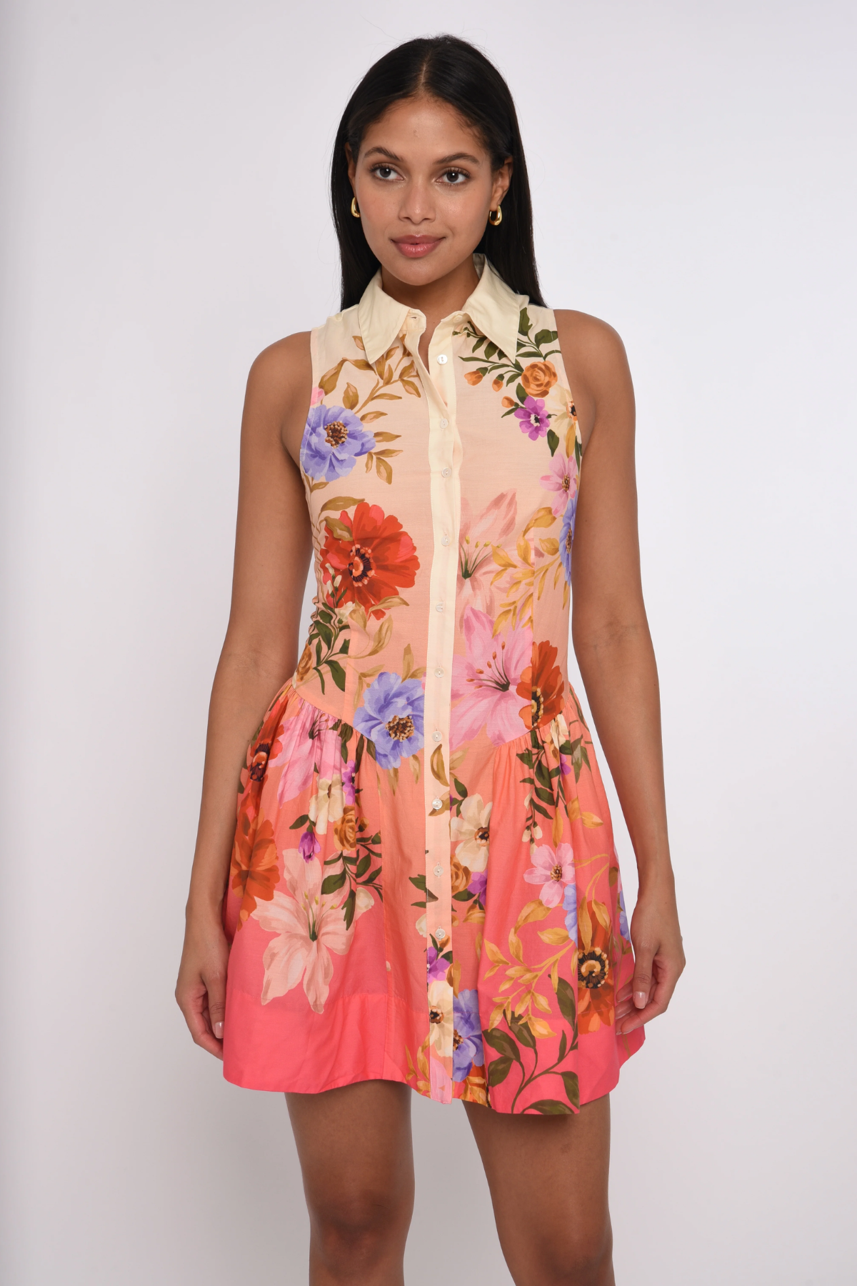 Woman wearing a floral dress with a white background