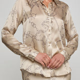 Beige patterned shirt and skirt set on a plain background