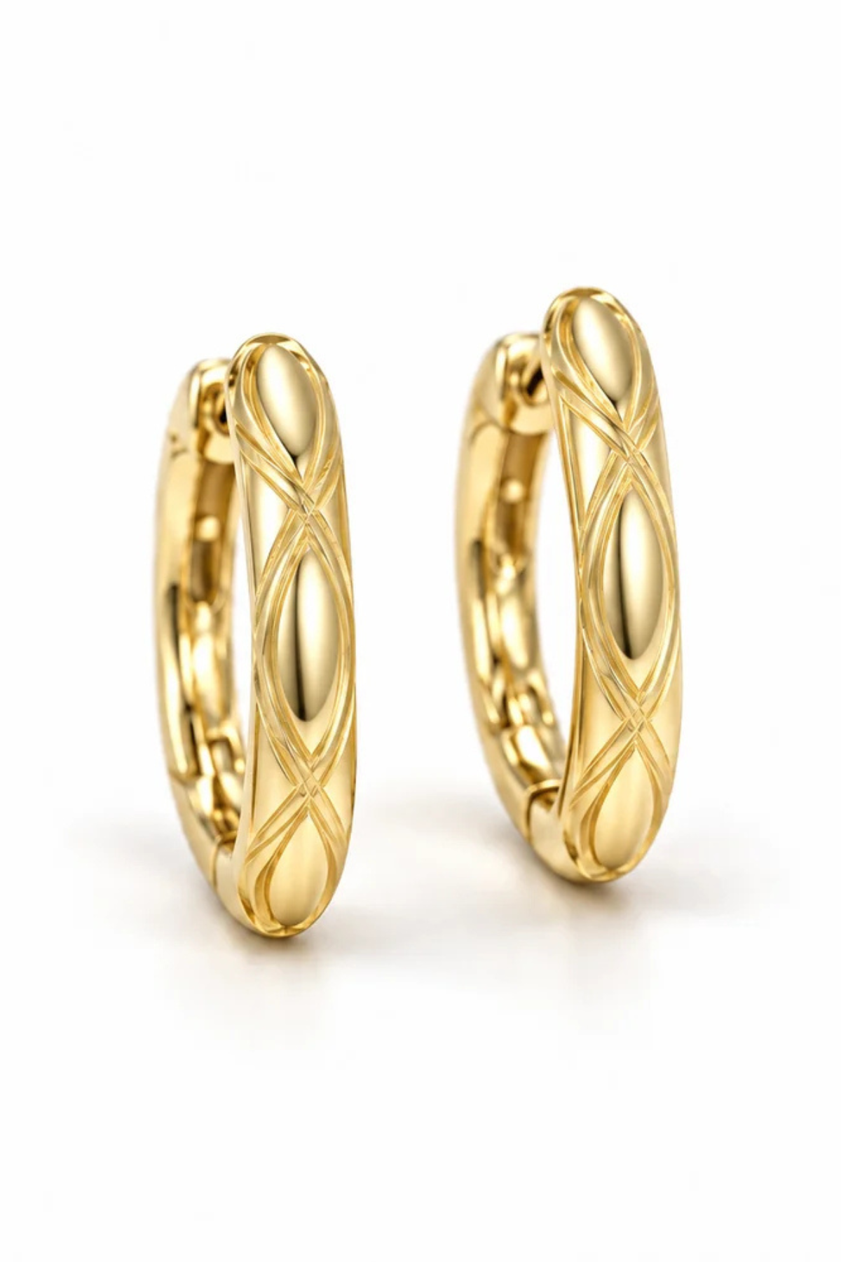 A pair of gold huggie hoop earrings with a textured, diamond-crossing pattern on a clean white background.