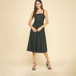 Black faux leather midi dress with button detailing.