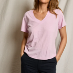 woman in pink t-shirt on draped background 