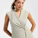 Champagne sparkle knit wrap top with rhinestone embellishment