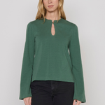 Women's green top featuring a keyhole neckline and feminine silhouette.