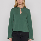 Women's green top featuring a keyhole neckline and feminine silhouette.