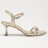 Gold high-heeled sandal with thin straps on a white background