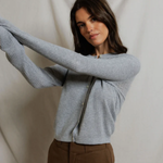 woman in grey cardigan 
