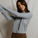 woman in grey cardigan 