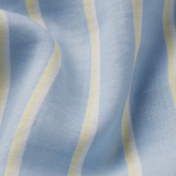close up of white, blue and yellow striped fabric 