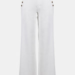 White pants with decorative buttons on a white background
