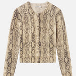 Cashmere cardigan with subtle snake pattern, styled with dark denim