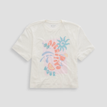 White t-shirt with colorful graphic design on a light gray background