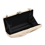 Beige clutch bag with black interior on a white background