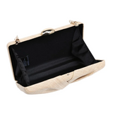 Beige clutch bag with black interior on a white background