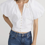 Blouse with dramatic voluminous sleeves styled with denim
